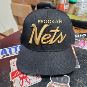 Gold script Brooklyn  Nets snap back cap by Mitchell and Ness